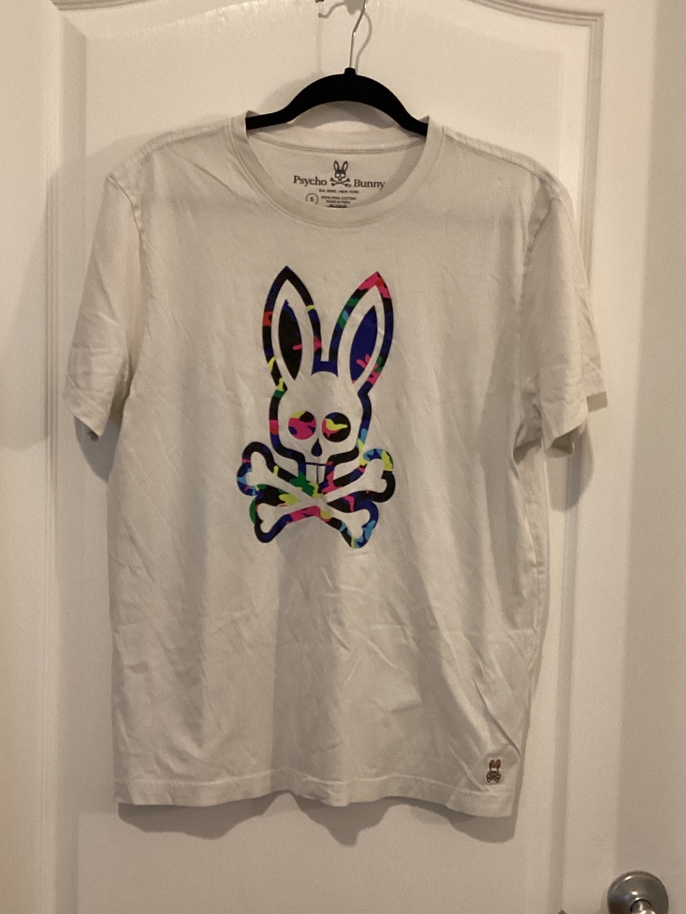 Psycho Bunny White Tee with Multicolor Skull-and-Crossbones Logo